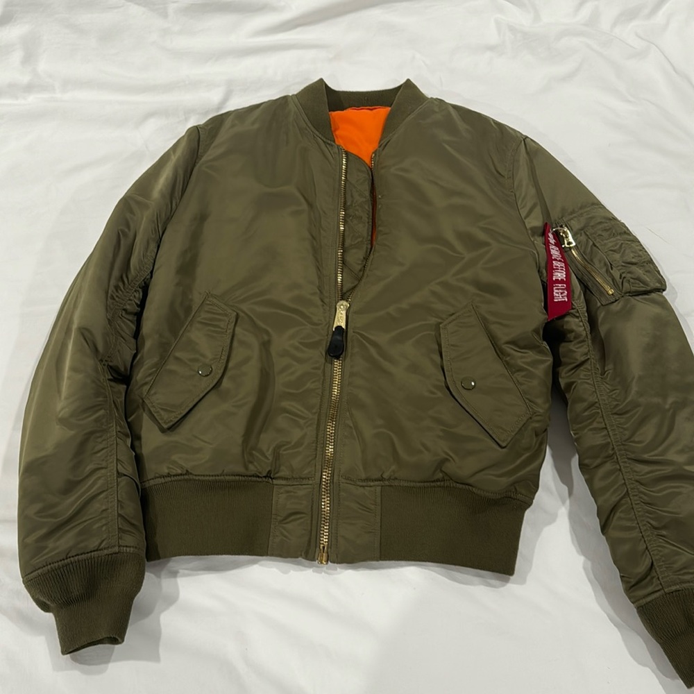 Alpha Industries Green Bomber Jacket with Orange interior.